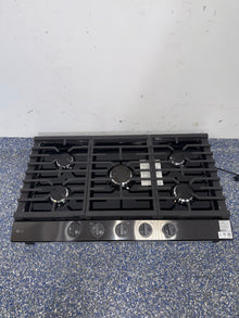 LG CBGJ3623D gas cooktop burners and continuous cast-iron grates in Kansas City