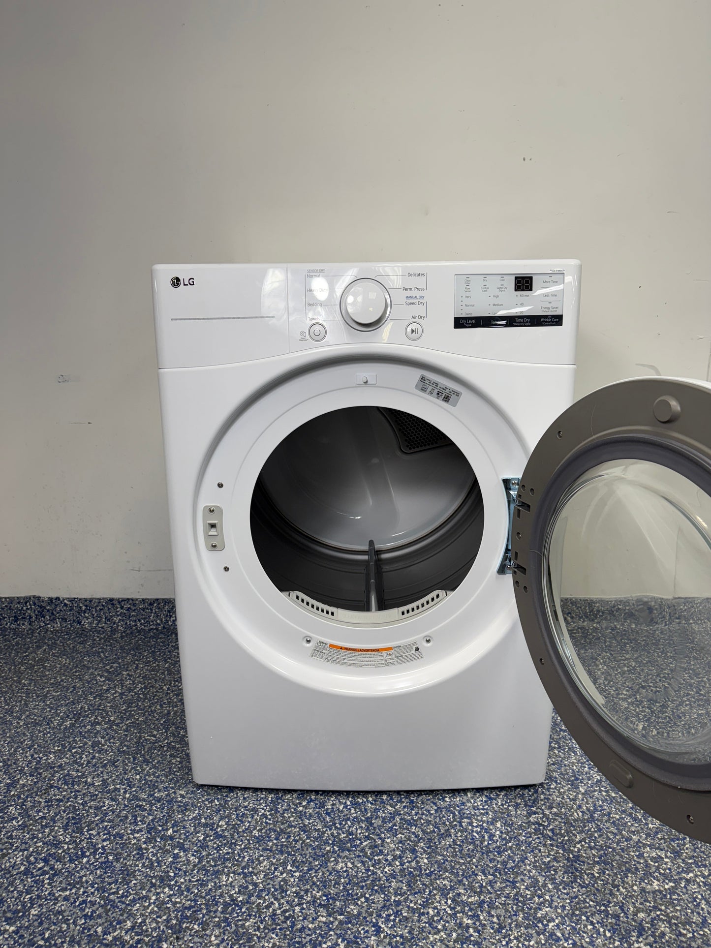 Interior drum of the LG DLE3400W front load dryer showing capacity near Kansas City.