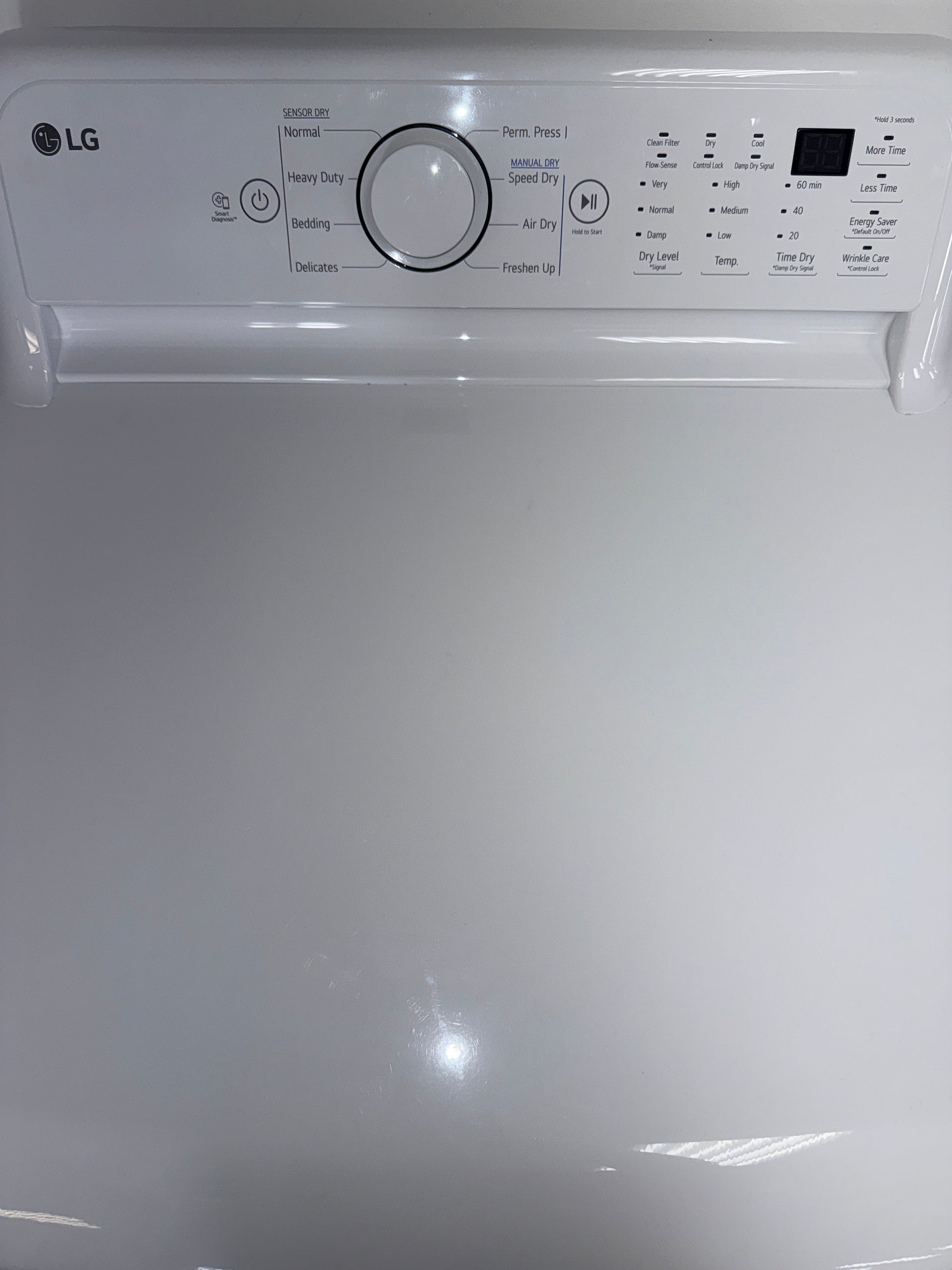 The interior of the LG DLE7000W dryer, showcasing the Wrinkle Care Option, for sale in Kansas.