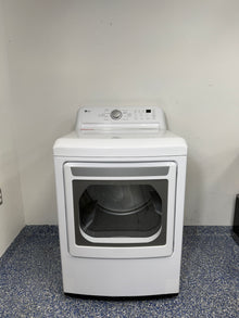 A full frontal image of the LG DLE7150W front-load electric dryer, highlighting its clean white finish and control panel. On sale at Appliance Shark - Scratch & Dent store | Kansas City.