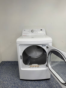 An overhead shot of the LG DLE7150W with the door open, showcasing the extra-large aluminized alloy steel drum. On sale at Appliance Shark - Scratch & Dent store | Kansas City.