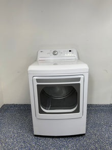 A full frontal image of the LG DLE7150W front-load electric dryer, highlighting its clean white finish and control panel. On sale at Appliance Shark - Scratch & Dent store | Kansas City.
