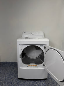 An overhead shot of the LG DLG6101W with the door open, showcasing the extra-large aluminized alloy steel drum. On sale at Appliance Shark - Scratch & Dent store | Kansas City.