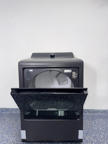 A side view of the LG DLG8401BE dryer, ready for installation in a Kansas City laundry room, with its SmartDiagnosis feature.