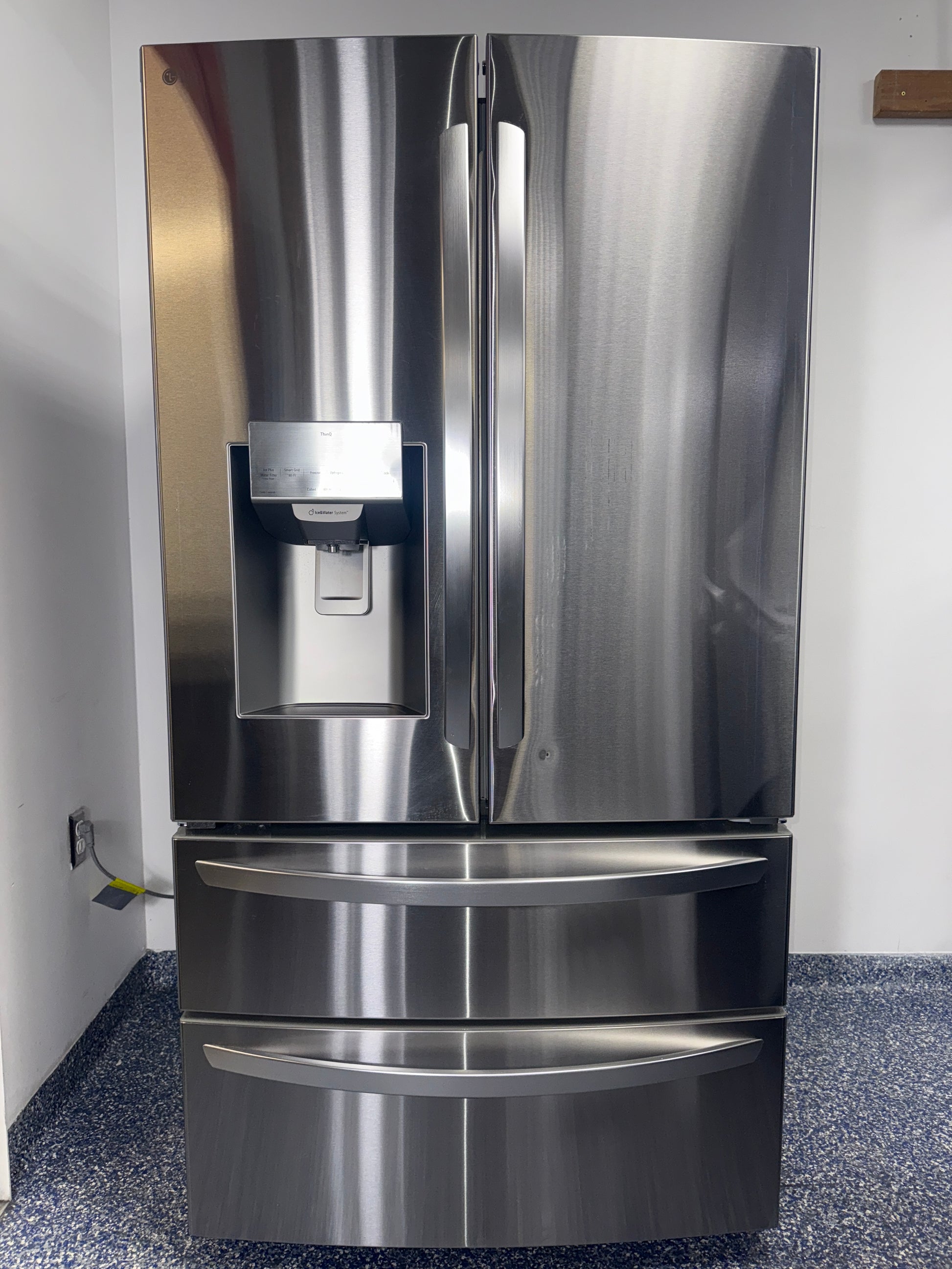 A close-up view of the Dual Ice Maker on the LG refrigerator, model LRMXS2806S, an ideal appliance for homes in Overland Park, KS.