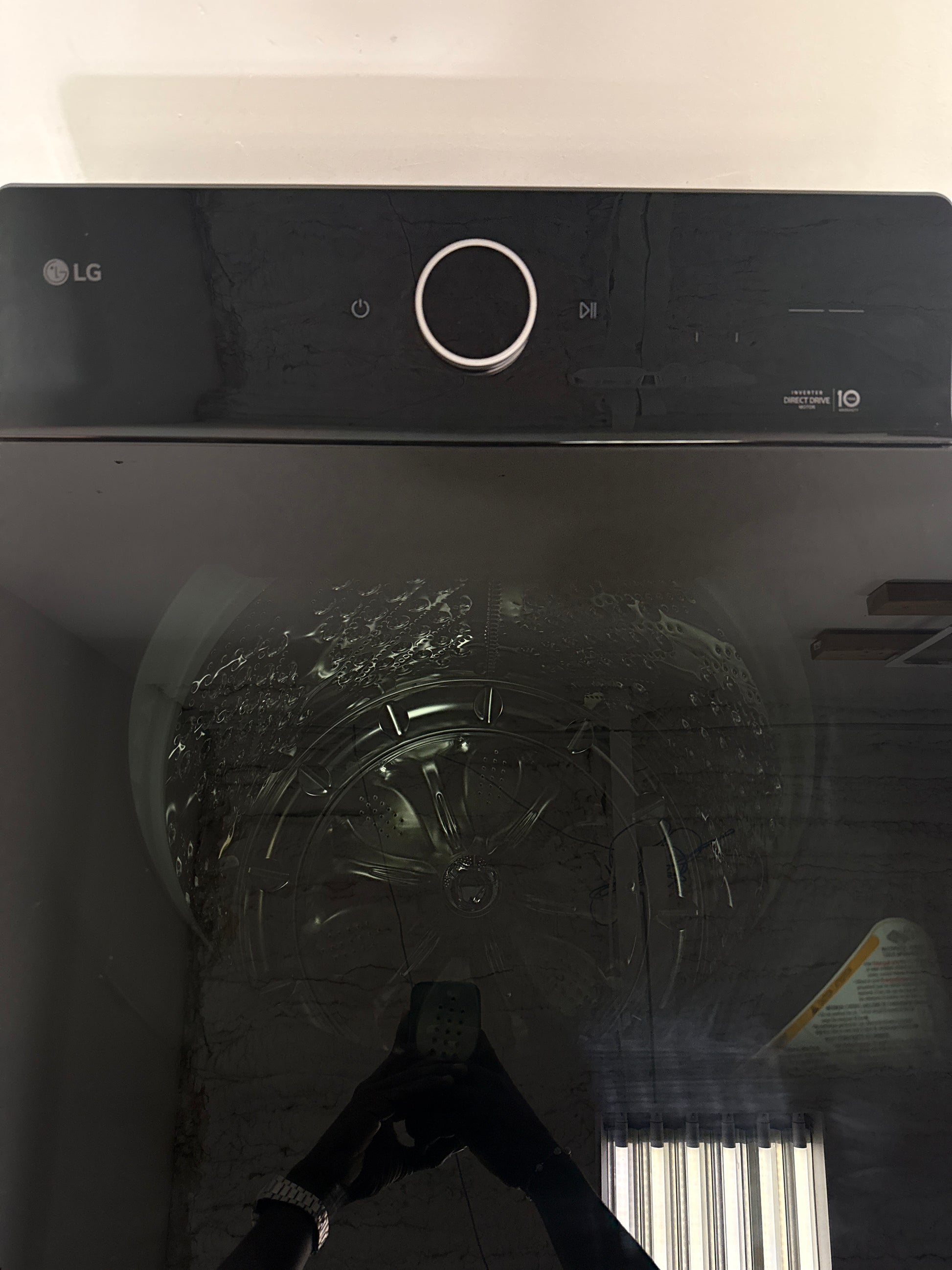 A close-up view of the ezDispense® Automatic Dispenser feature on the LG WT8600CB washer, perfect for an Overland Park, KS home.