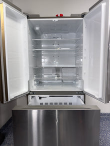 The LG LF21G6200S refrigerator, with a focus on its built-in automatic ice maker, for sale in Kansas.