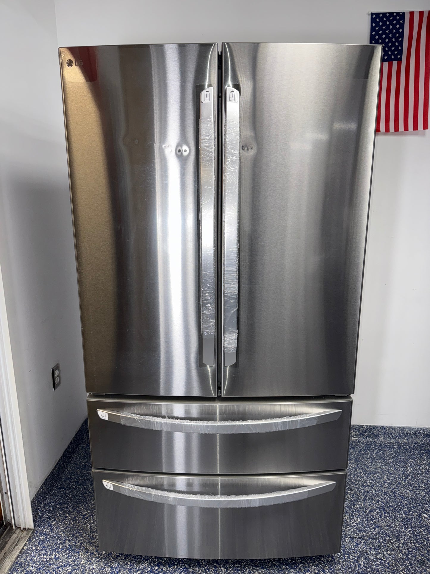 Front view of the LG LMWS29626S 29 cu ft 4-door French Door refrigerator in PrintProof™ stainless steel, available in Overland Park, KS.