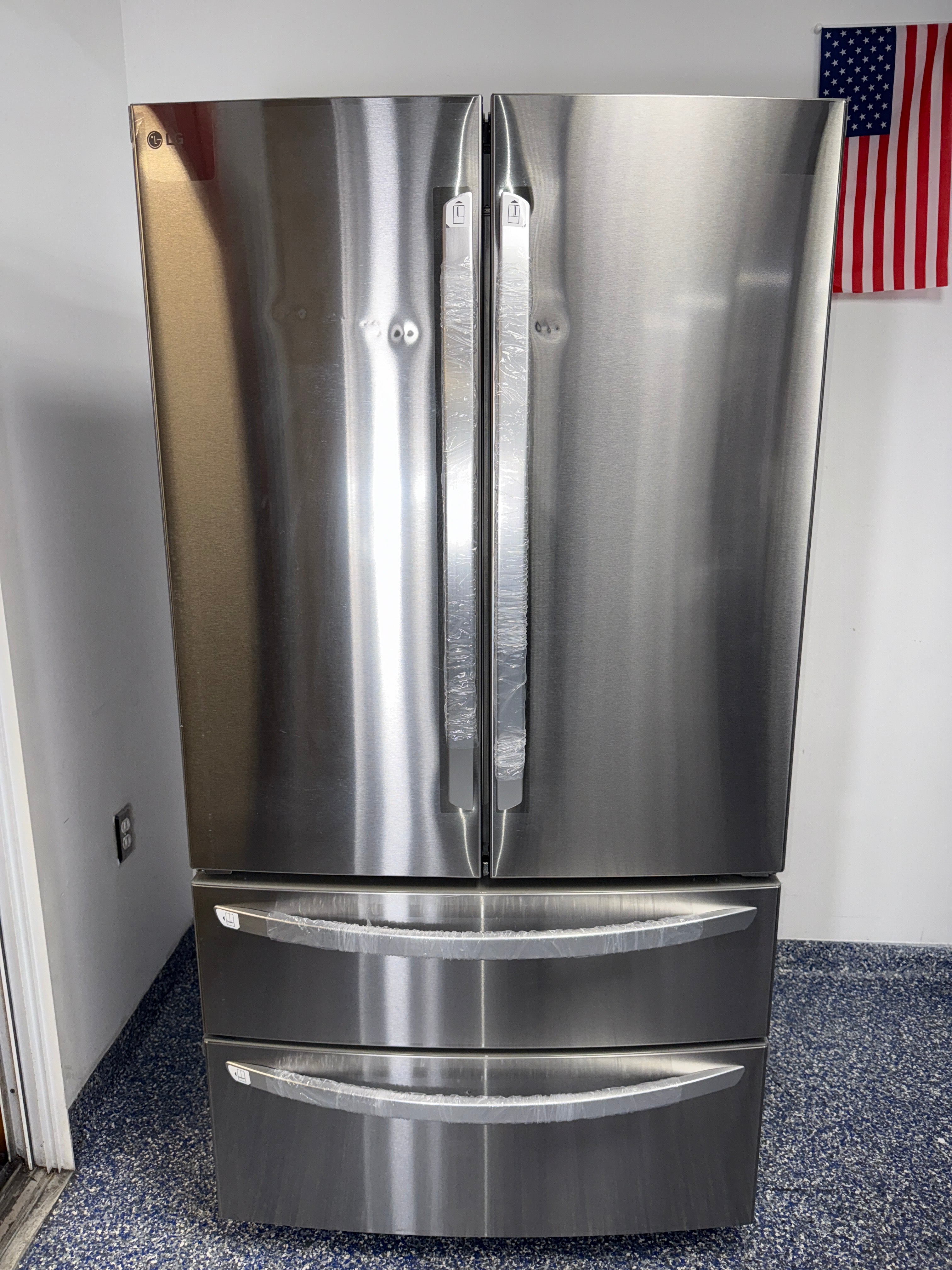 Front view of the LG LMWS29626S 29 cu ft 4-door French Door refrigerator in PrintProof™ stainless steel, available in Overland Park, KS.