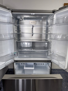 The LG LRFLC2716S refrigerator, with a focus on its internal water dispenser, for sale in Kansas.