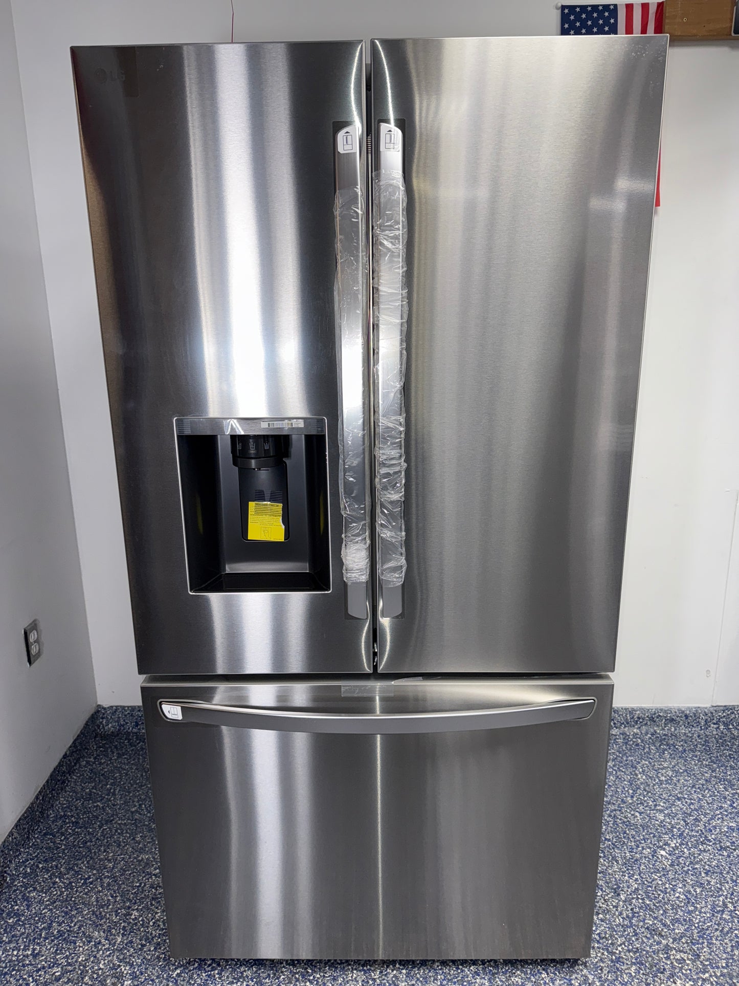 Front view of the LG LRFXS3106S 30.7 cu ft French door refrigerator in PrintProof® stainless steel, available in Overland Park, KS.