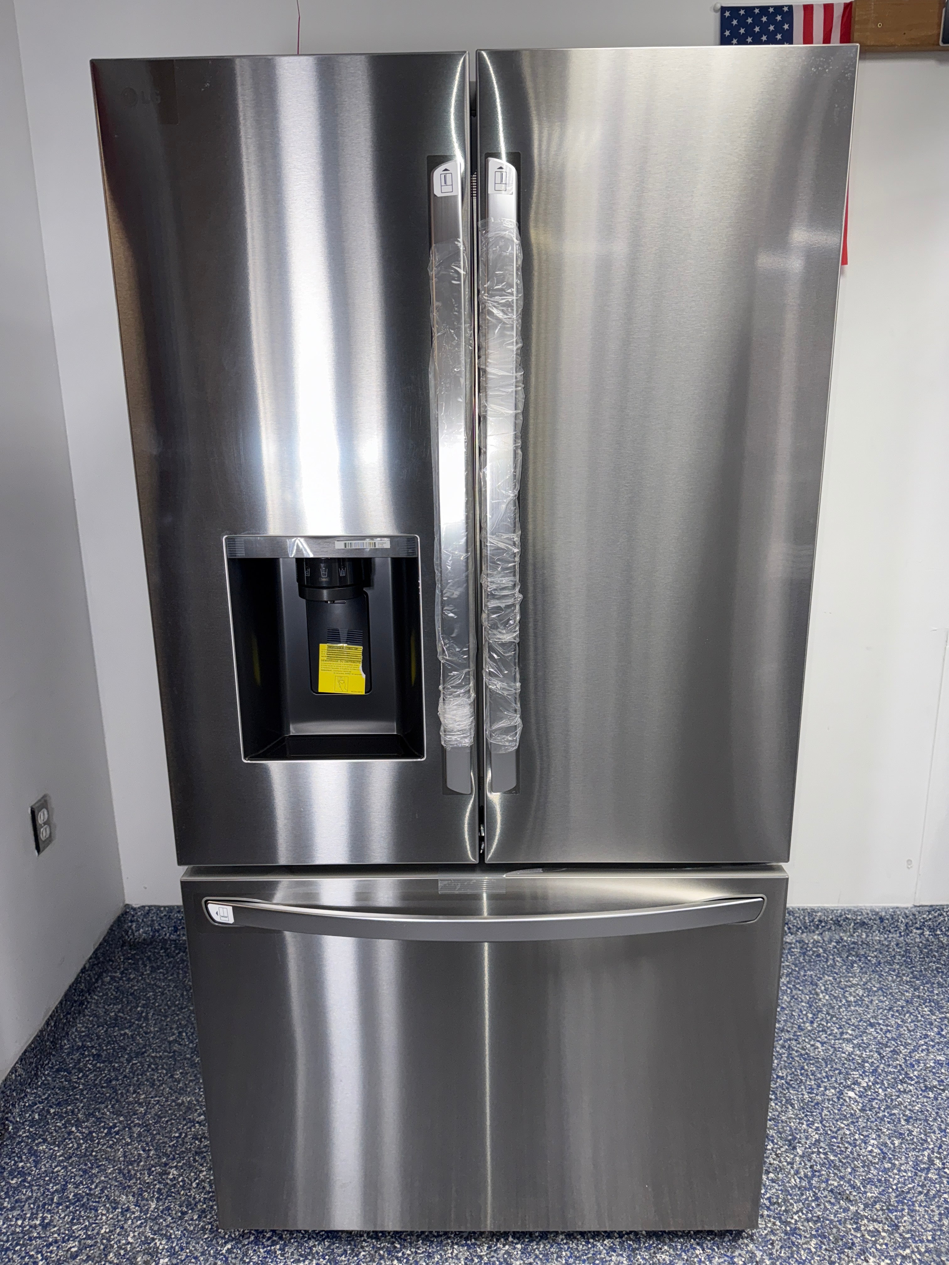 Front view of the LG LRFXS3106S 30.7 cu ft French door refrigerator in PrintProof® stainless steel, available in Overland Park, KS.