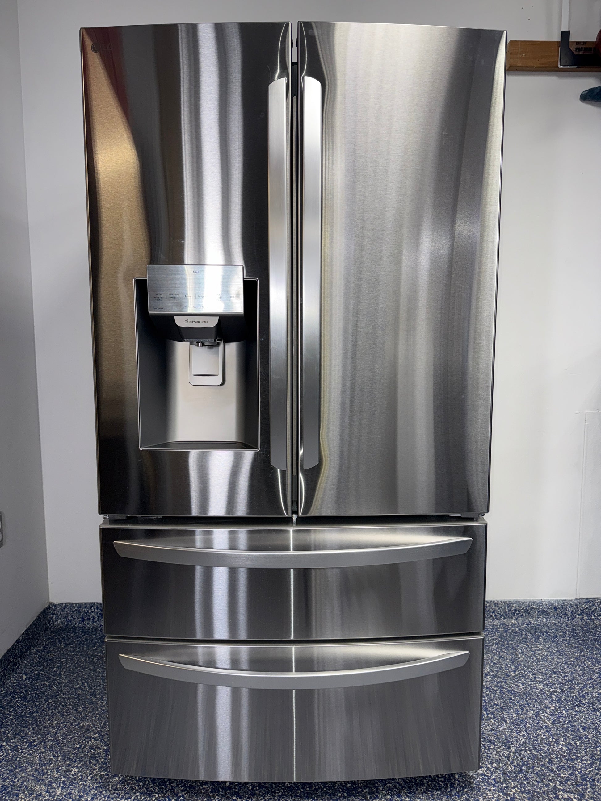 A view of the dual icemaker inside the LG LRMXS2806S refrigerator, for sale in Kansas.