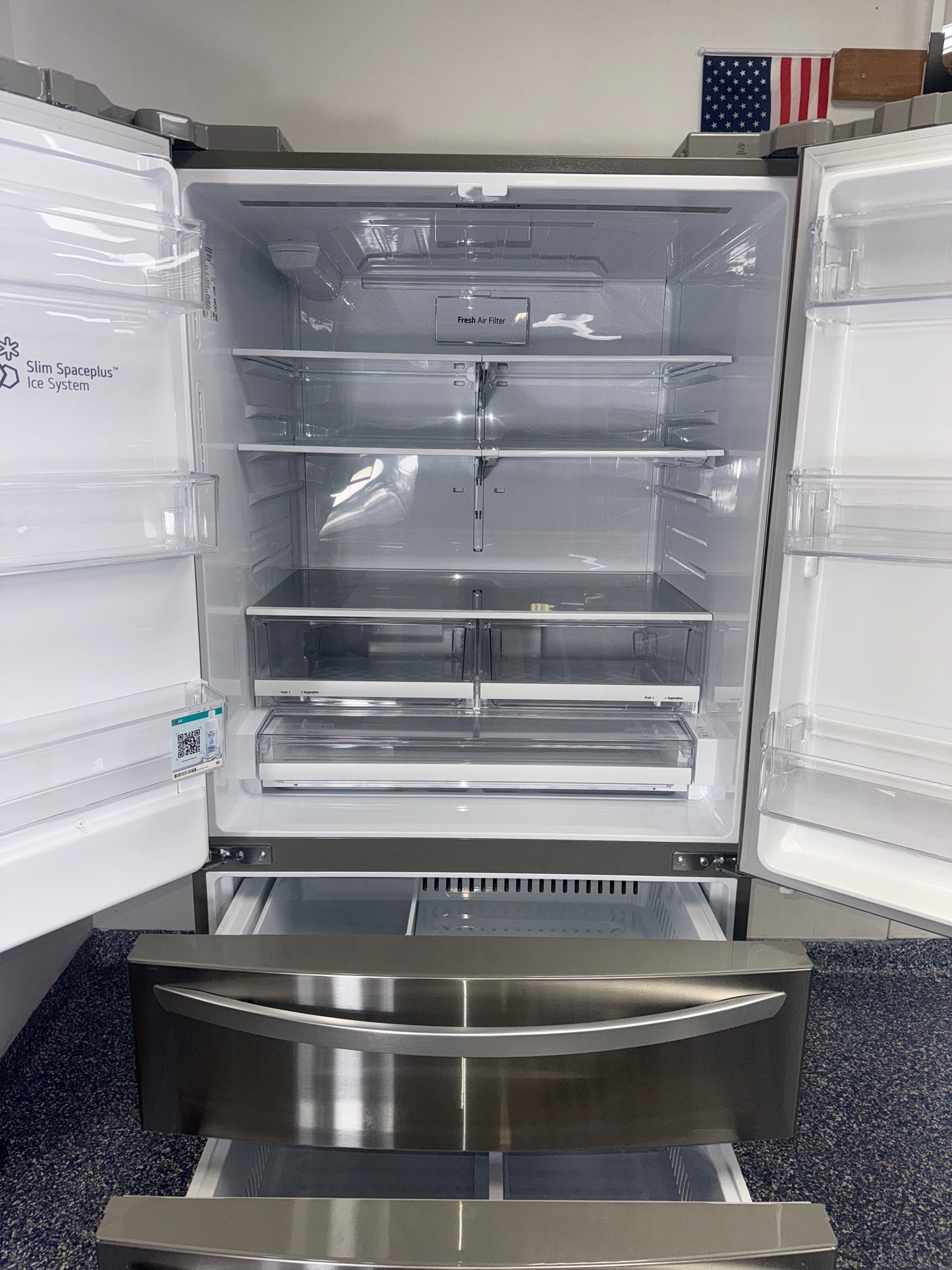 Interior view of the LG LRMXS2806S showing dual ice makers and ample storage, for Kansas City homes.