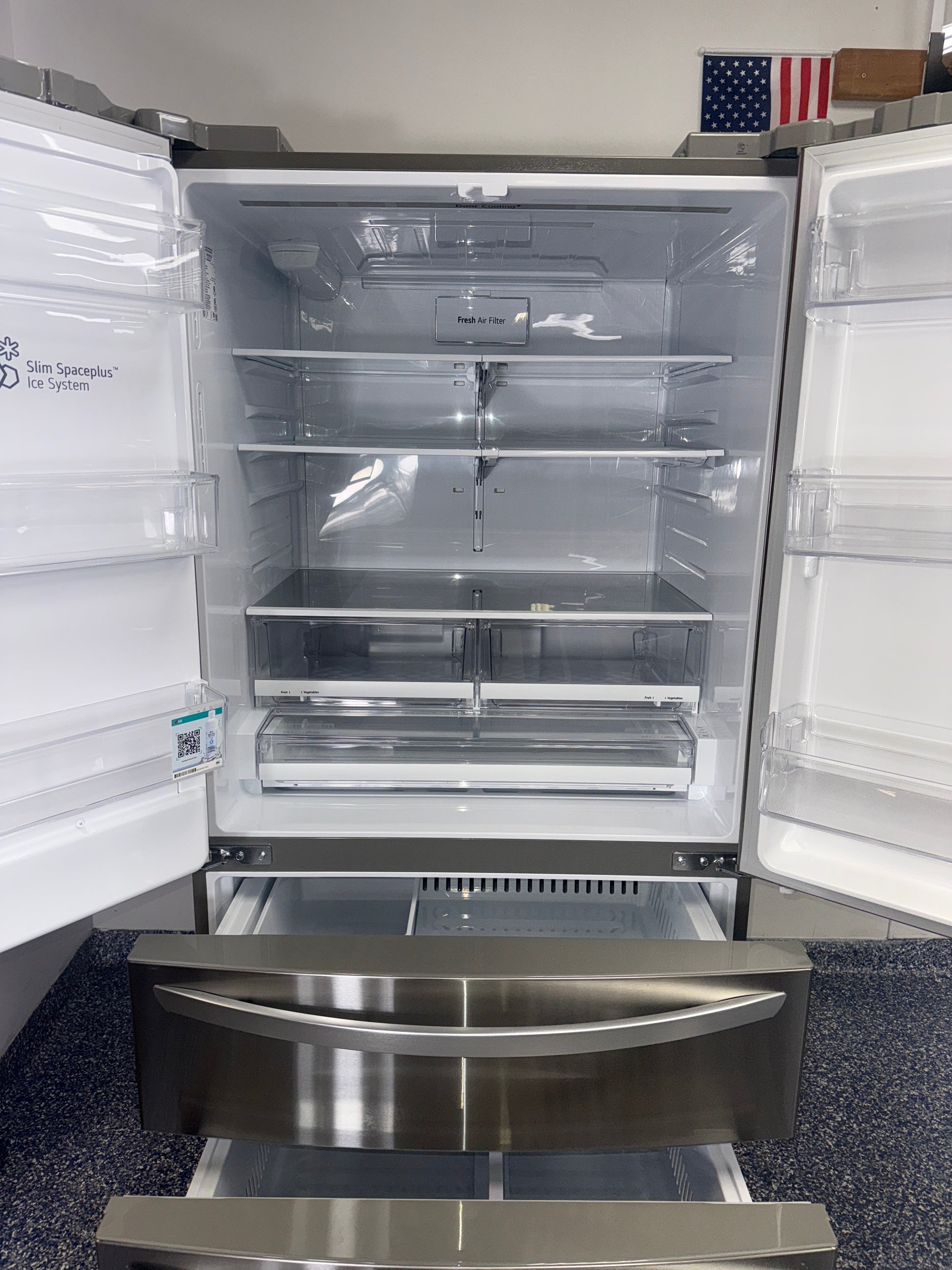 Interior view of the LG LRMXS2806S showing dual ice makers and ample storage, for Kansas City homes.