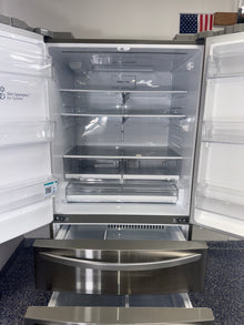 Interior view of the LG LRMXS2806S showing dual ice makers and ample storage, for Kansas City homes.