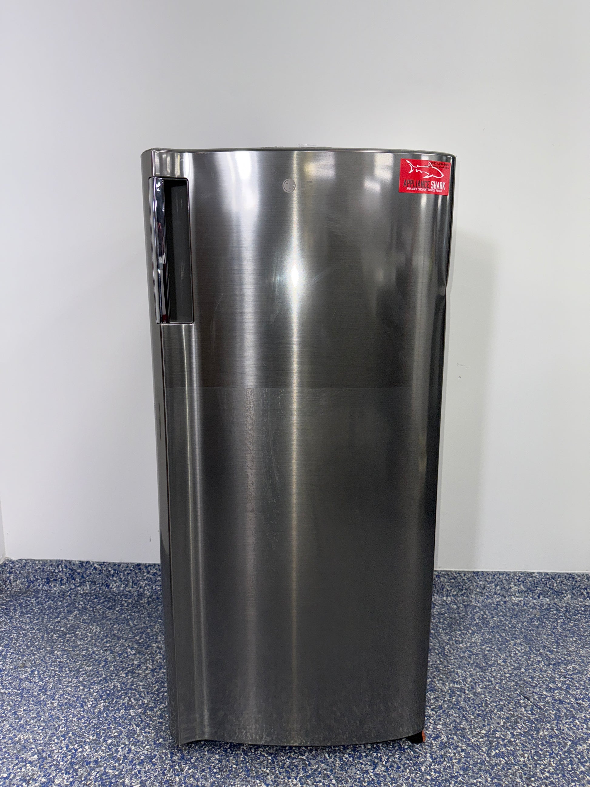Adjustable glass shelving inside LG LRONC0605V compact refrigerator, available as a scratch and dent deal in Kansas City.