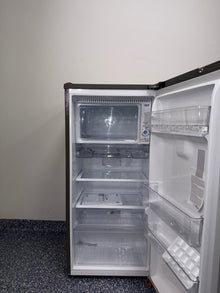 Interior of LG LRONC0605V compact refrigerator showing 5.8 cu. ft. capacity, available as a scratch and dent deal in Kansas City.