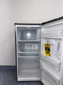 Interior of LG LRONC0605V mini fridge showing adjustable shelving, available as a scratch and dent deal in Kansas City.