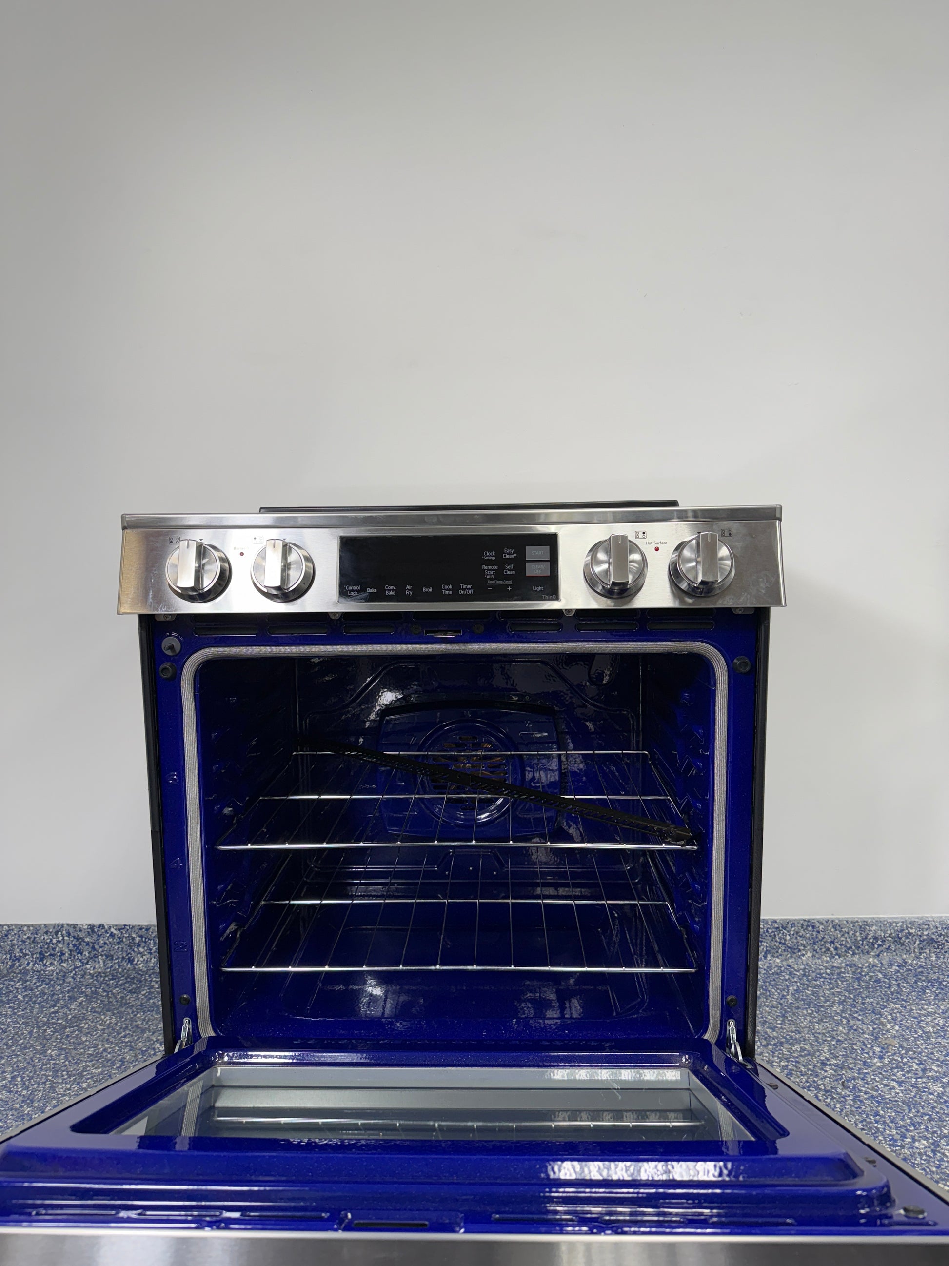 Cooktop view of LG LSIL6334FE induction range with 4 powerful elements, discounted at Appliance Shark in Kansas City.