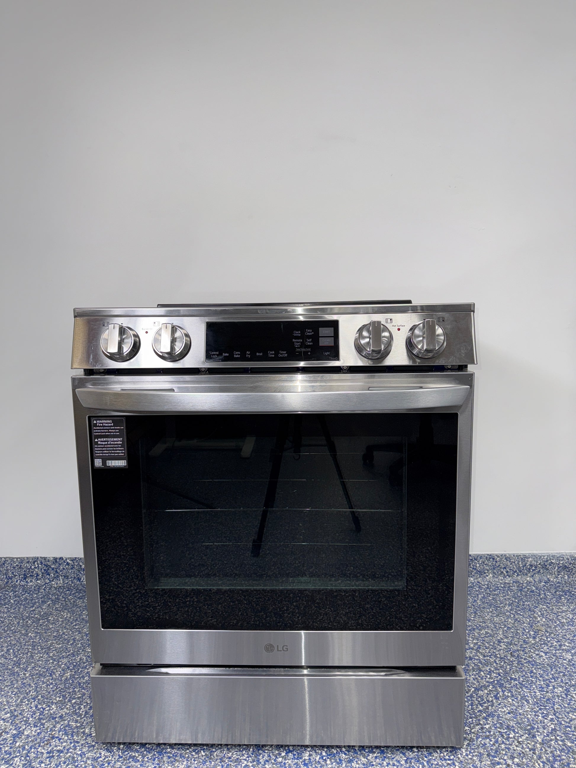 Front view of the LG LSIL6334FE 6.3 cu ft slide-in induction range in PrintProof® stainless steel, available in Overland Park, KS.