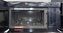 The LG over-the-range microwave with its glass controls and Sensor Cooking technology, an ideal appliance for homes in Overland Park.