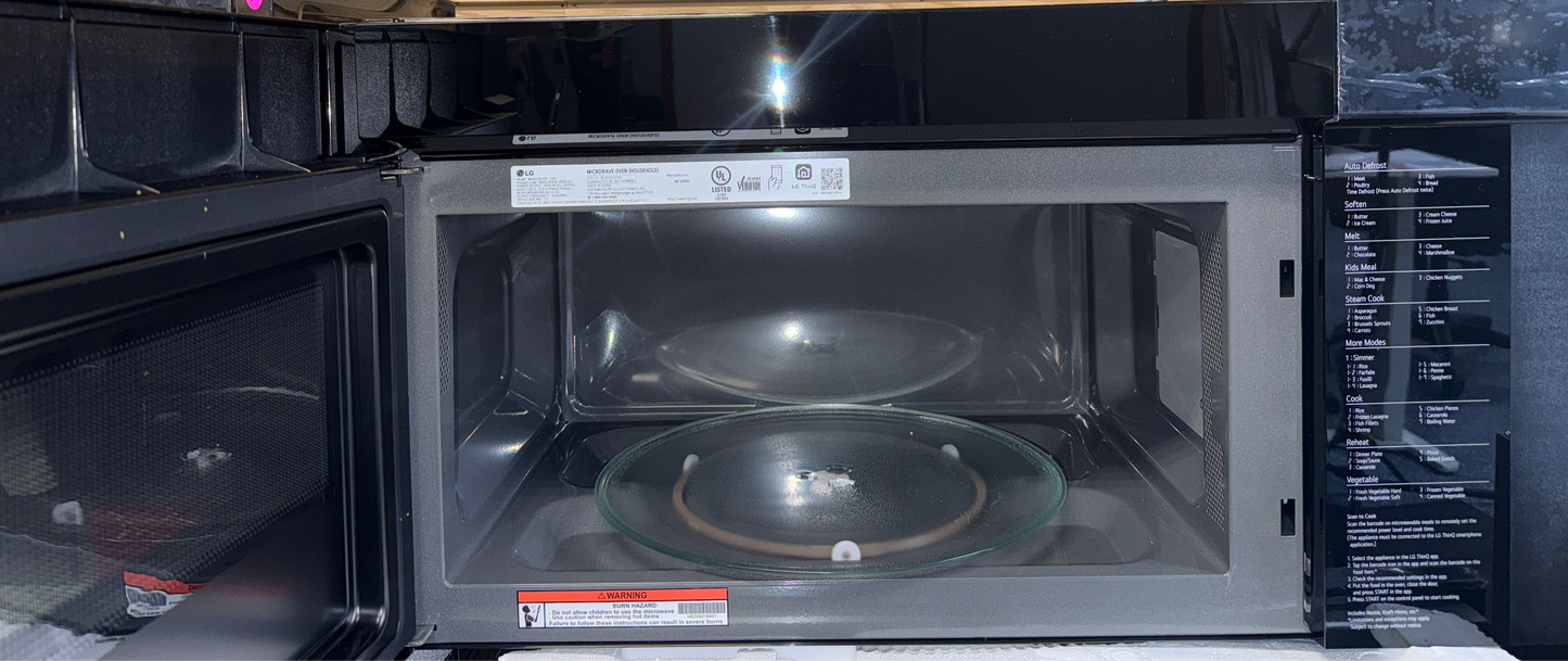 Control panel of LG MVEL2033F over-the-range microwave in an Overland Park kitchen.