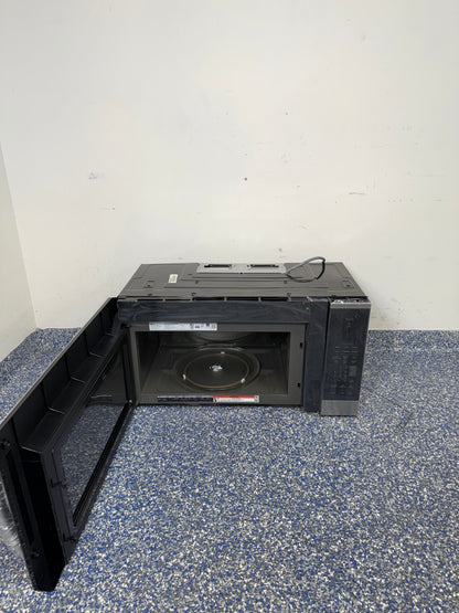 An overhead shot of the LG MVEM1825F with the door open, showcasing the spacious 1.8 cu ft interior. On sale at Appliance Shark - Scratch & Dent store | Kansas City.