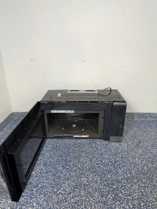 An overhead shot of the LG MVEM1825F with the door open, showcasing the spacious 1.8 cu ft interior. On sale at Appliance Shark - Scratch & Dent store | Kansas City.