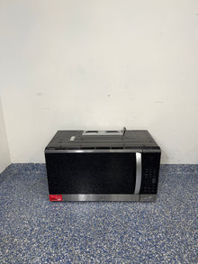 A full frontal image of the LG MVEM1825F over-the-range microwave, highlighting its PrintProof™ Stainless Steel finish, recessed pocket handle, and sleek modern design. On sale at Appliance Shark – Scratch & Dent store | Kansas City.