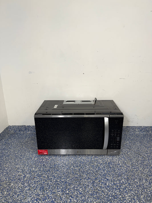 A full frontal image of the LG MVEM1825F over-the-range microwave, highlighting its PrintProof™ Stainless Steel finish, recessed pocket handle, and sleek modern design. On sale at Appliance Shark – Scratch & Dent store | Kansas City.