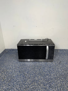 A full frontal image of the LG MVEM1825F over-the-range microwave, highlighting its Stainless Steel finish and sleek design. On sale at Appliance Shark - Scratch & Dent store | Kansas City.