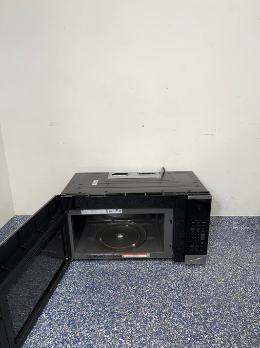 An overhead shot of the LG MVEM1825F with the door open, showcasing the spacious 1.8 cu ft interior. On sale at Appliance Shark - Scratch & Dent store | Kansas City.