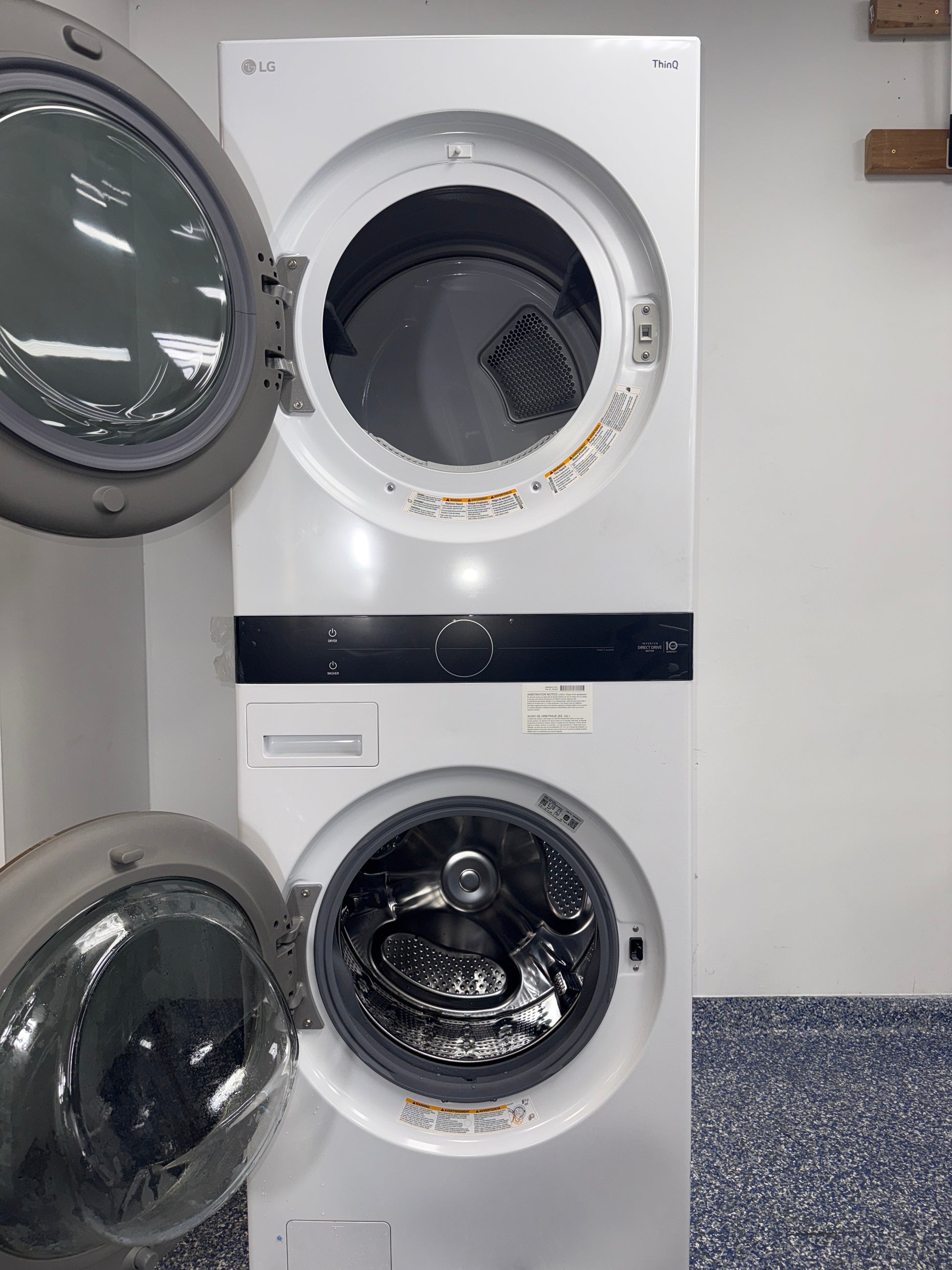 A front view of the LG WKG101HWA WashTower™, highlighting its space-saving vertical design, ready for installation in a Kansas City laundry room.