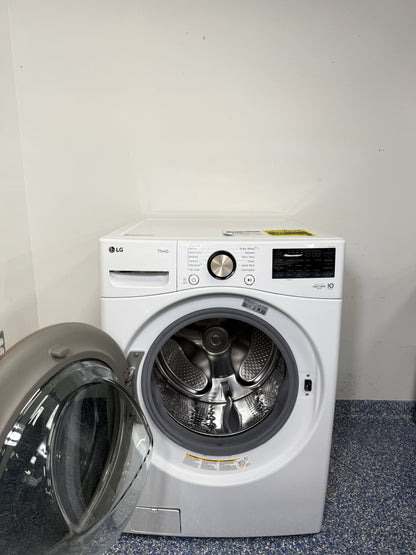 An overhead shot of the LG WM4000HWA with the door open, revealing the large stainless steel drum and ultra-large capacity. On sale at Appliance Shark - Scratch & Dent store | Kansas City.