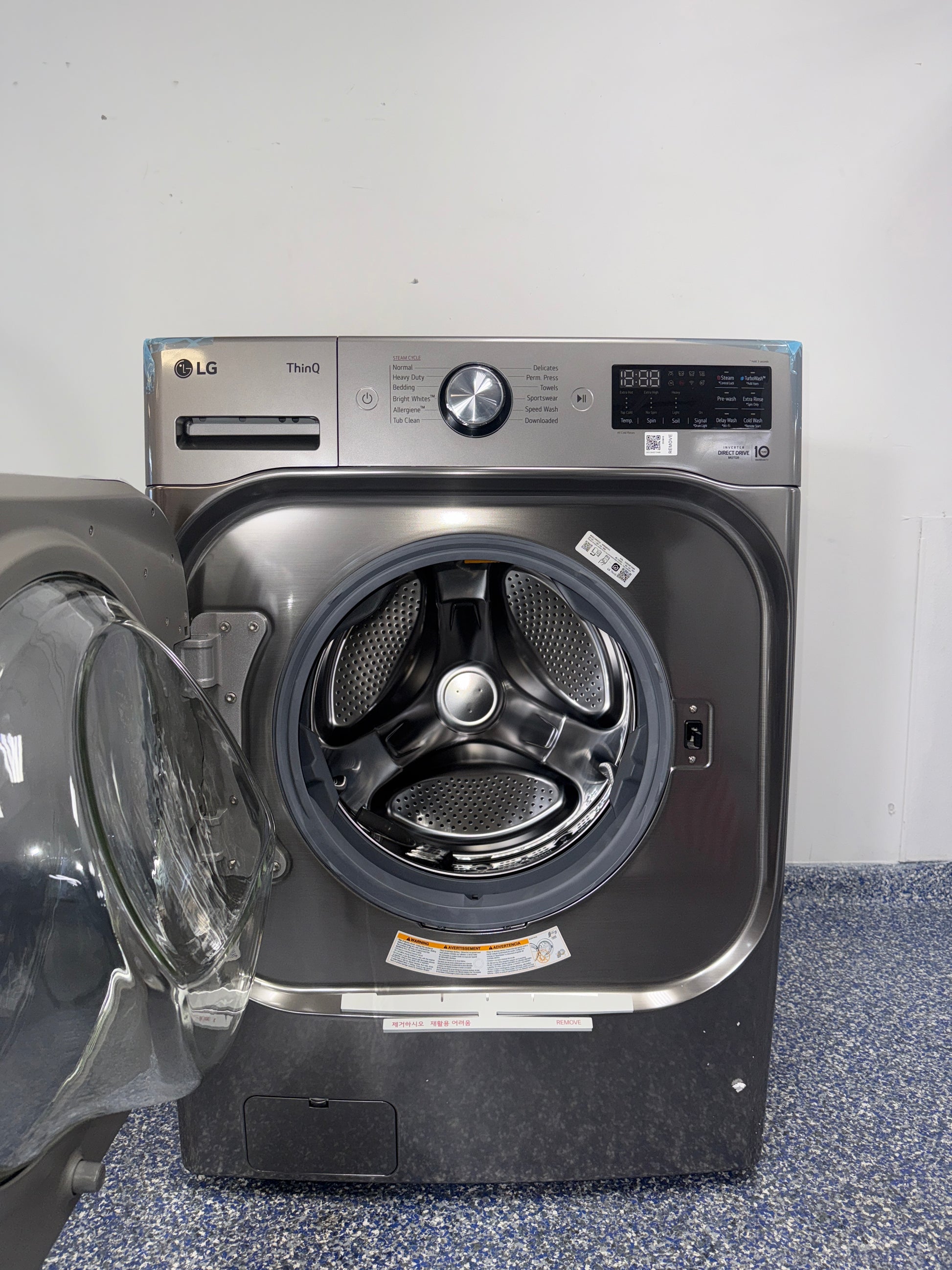 Control panel of the LG WM8980HVA showing ThinQ® and advanced wash options, featured in Kansas City homes.