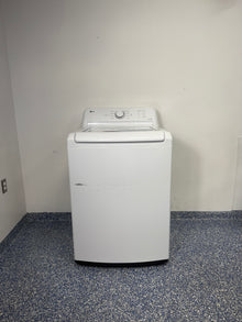 A full frontal image of the LG WT6105CW top-load washing machine, highlighting its classic white finish and knob controls. On sale at Appliance Shark - Scratch & Dent store | Kansas City.