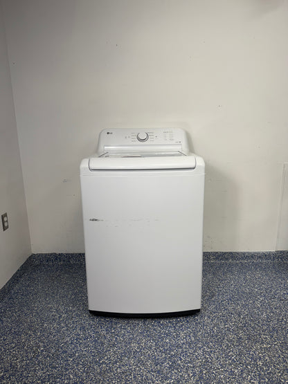 A full frontal image of the LG WT6105CW top-load washing machine, highlighting its classic white finish and knob controls. On sale at Appliance Shark - Scratch & Dent store | Kansas City.