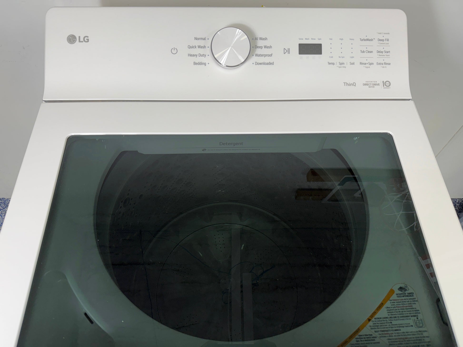 Close-up of the LG WT8200CW washer's control panel, showing the cycle selector dial. On sale at Appliance Shark - Scratch & Dent store | Kansas City.