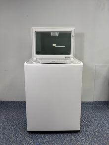 Top view of the LG WT8200CW washer with its lid open, showing the large stainless steel drum and mega capacity. On sale at Appliance Shark - Scratch & Dent store | Kansas City.