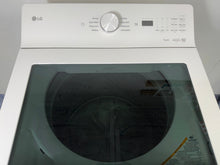 The interior of the LG WT8205CW washer, showing the NeveRust™ stainless steel drum and ColdWash™ technology, for sale in Kansas.