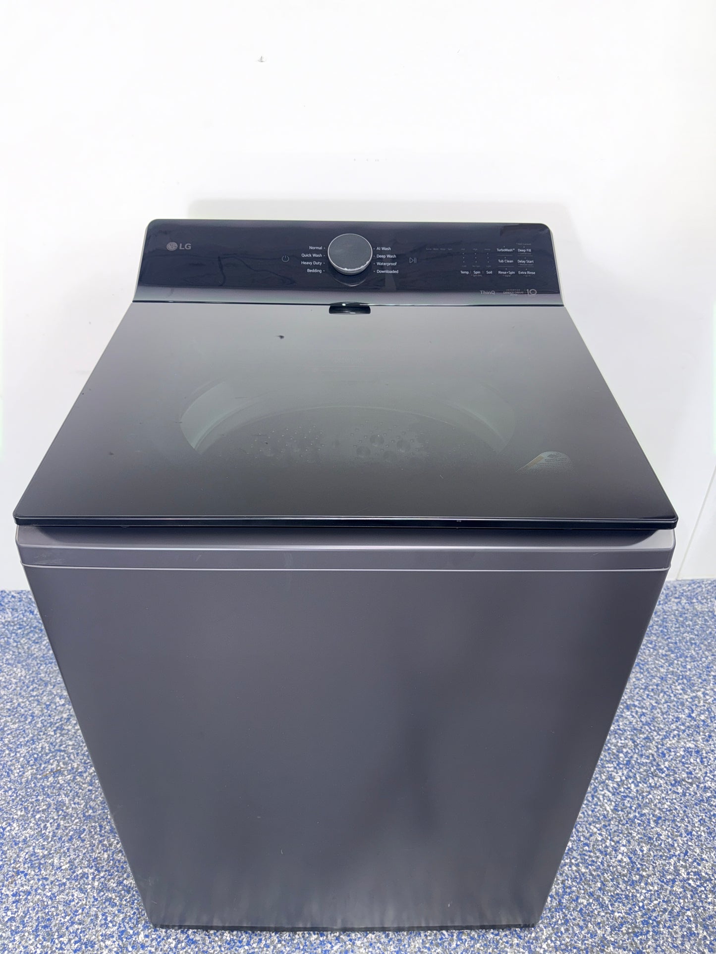 Open-lid view showing the stainless steel washplate of the LG WT8600CB washer, featured in Kansas City homes.