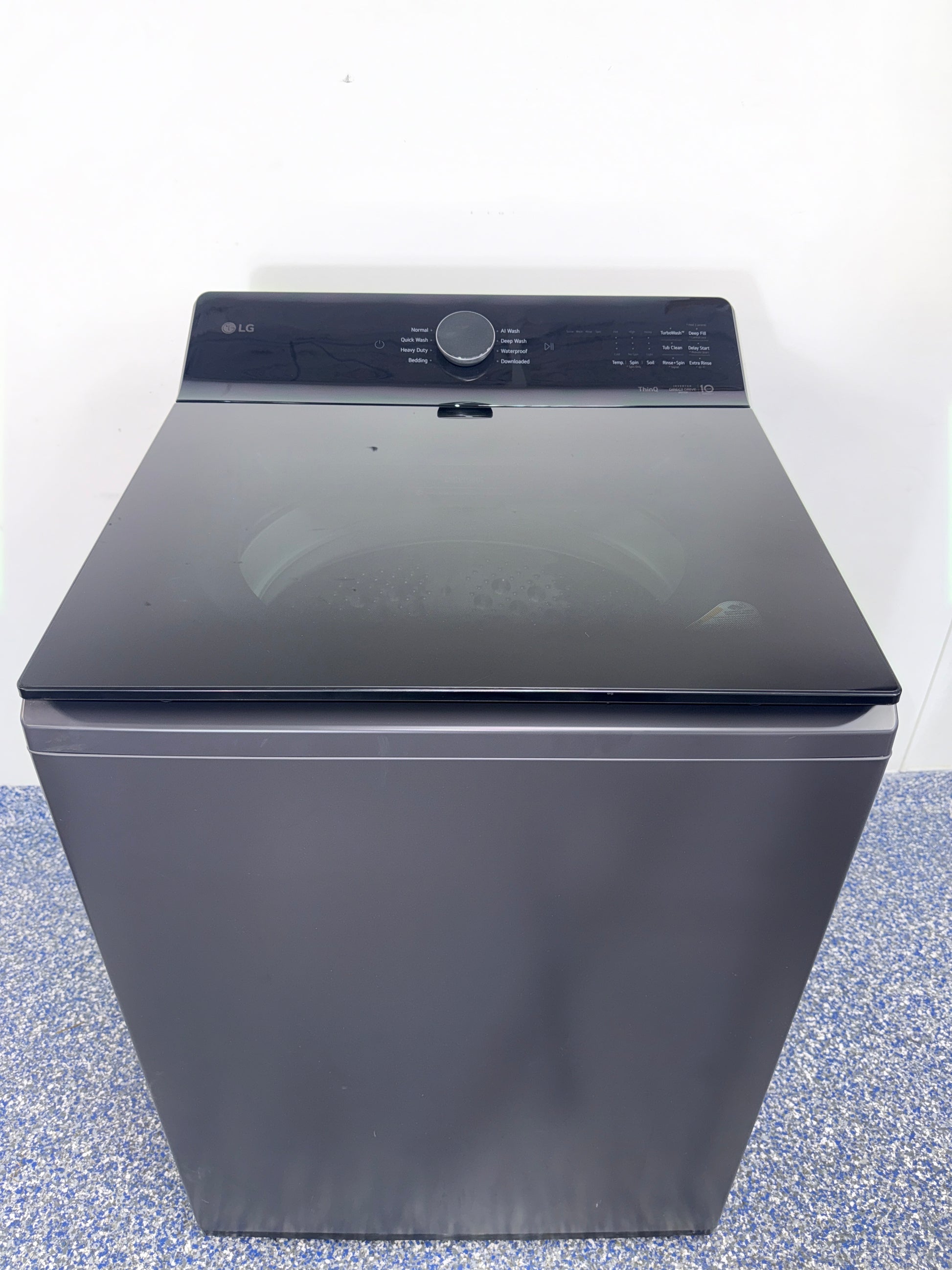 Open-lid view showing the stainless steel washplate of the LG WT8600CB washer, featured in Kansas City homes.