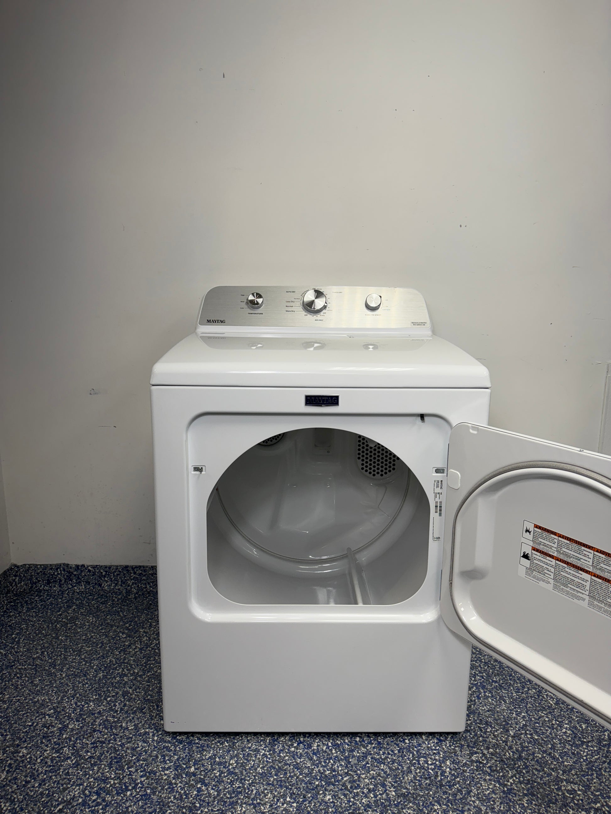 An overhead shot of the MAYTAG MED4500MW with the door open, showcasing the spacious drum interior and Auto Dry Control sensor. On sale at Appliance Shark - Scratch & Dent store | Kansas City.