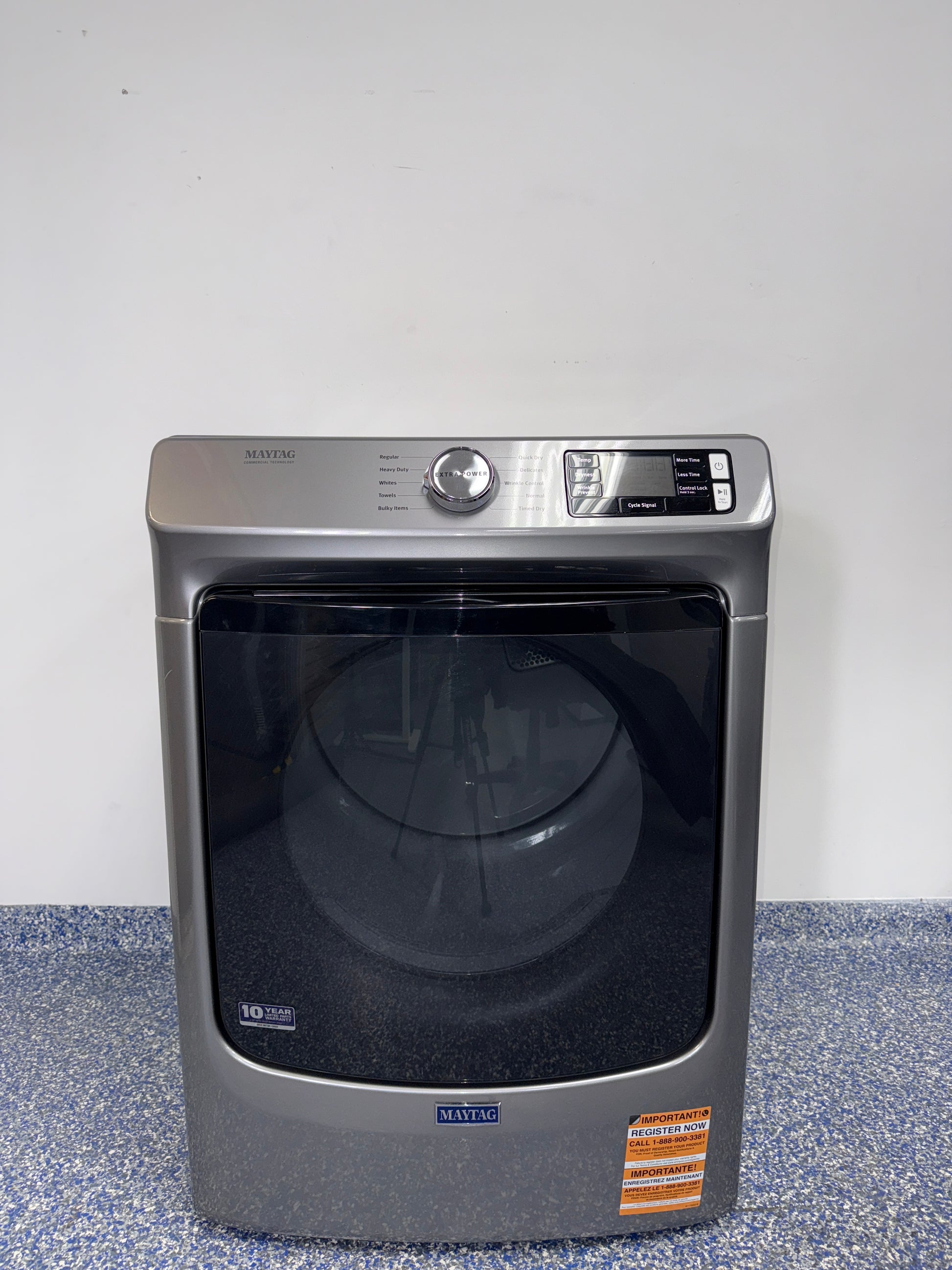 A front view of the MAYTAG MED5630HC dryer, highlighting its heavy-duty motor, ready for installation in a Kansas City laundry room.