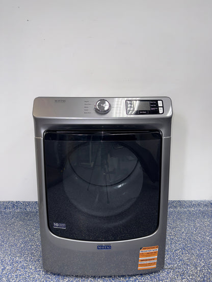 A front view of the MAYTAG MED5630HC dryer, highlighting its heavy-duty motor, ready for installation in a Kansas City laundry room.