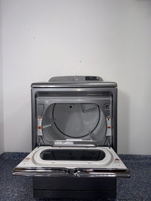 The interior of the MAYTAG MED7230HC dryer, showing the spacious drum and Sanitize Cycle option, for sale in Kansas.