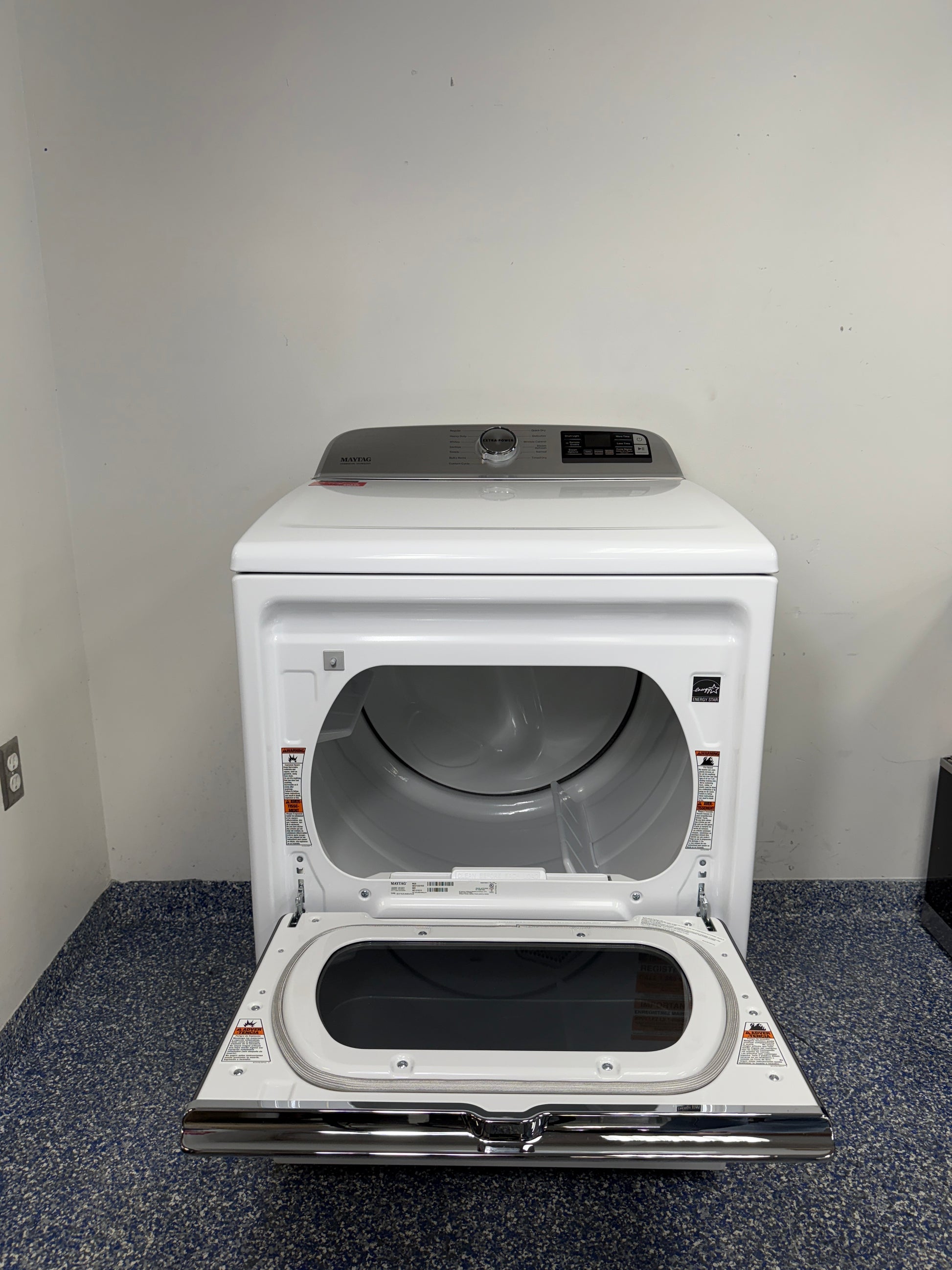 An overhead shot of the Maytag MED7230HW with the hamper-style door open, showcasing the spacious drum interior. On sale at Appliance Shark - Scratch & Dent store | Kansas City.