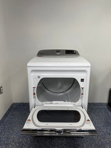 An overhead shot of the Maytag MED7230HW with the hamper-style door open, showcasing the spacious drum interior. On sale at Appliance Shark - Scratch & Dent store | Kansas City.