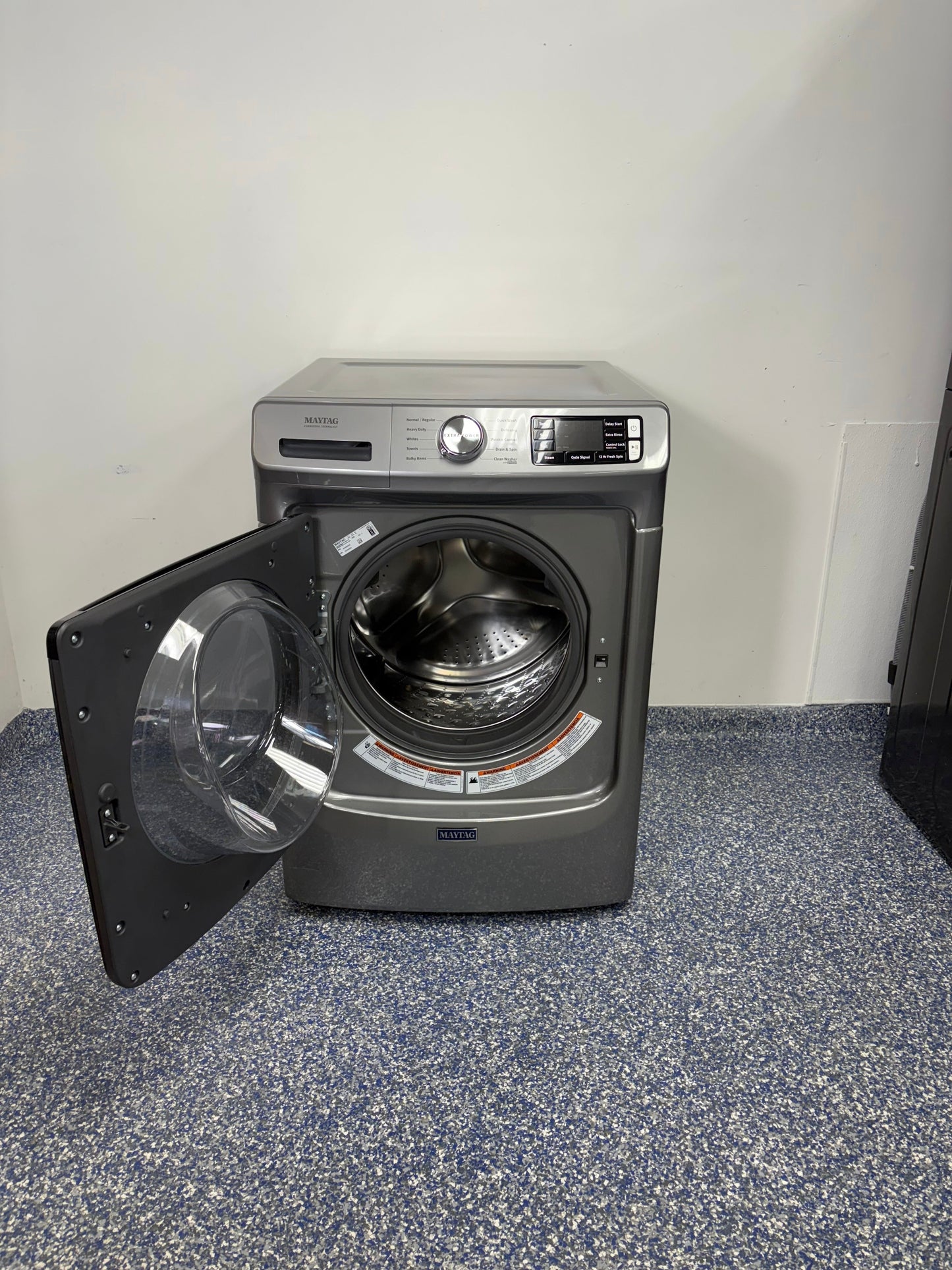 Close-up of the Extra Power button on the MAYTAG MHW5630HC front-load washer, shown for Kansas City homes.